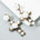 <tc>Años 50</tc> Pendientes Cruz Rosa Barroca